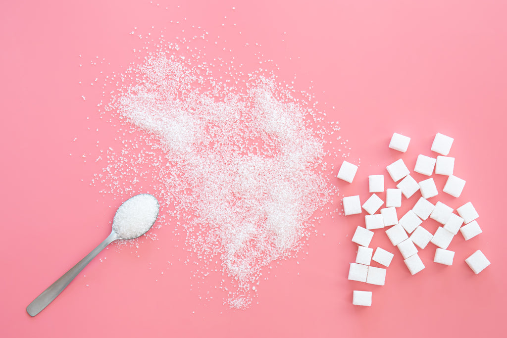 silver spoon with granulated sugar